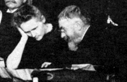 Marie Curie y Henri Poincaré en la Conferencia de Solvay de 1911